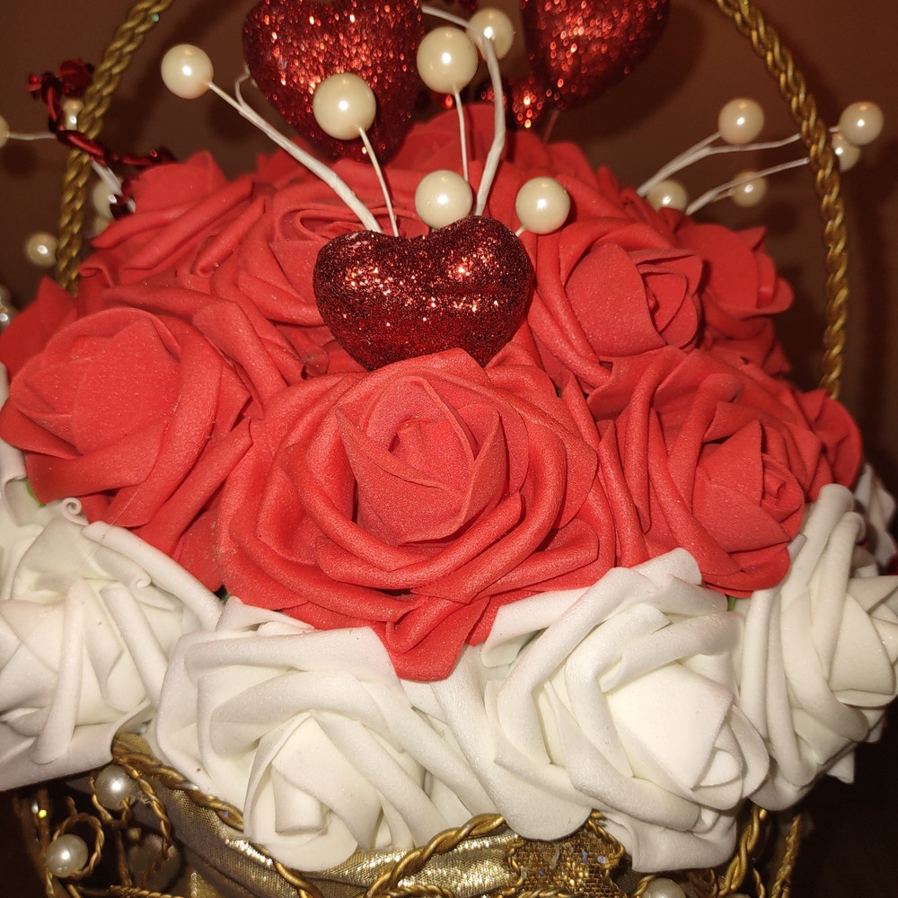 Accent  Piece  Faux Rose Arrangement with Heart Details on Metal Basket.